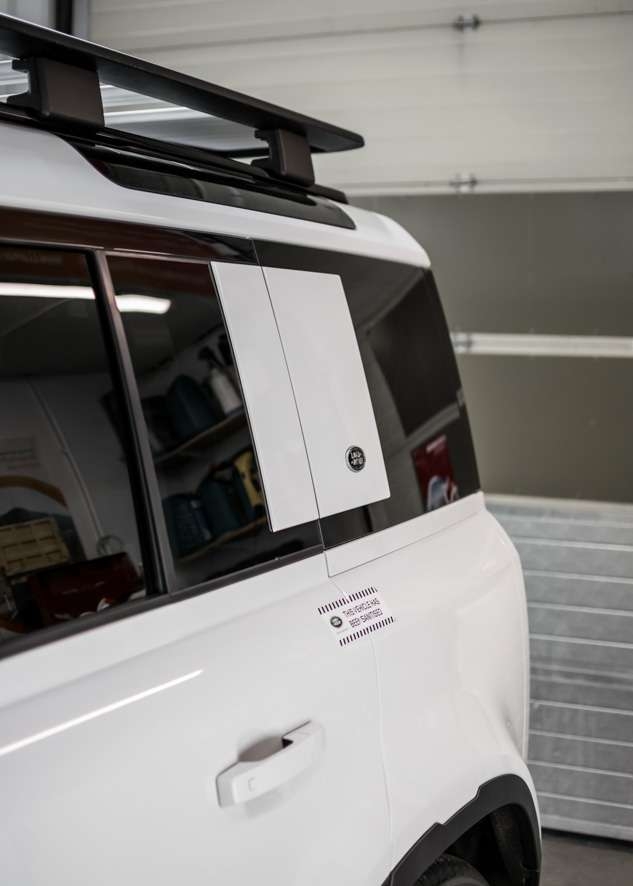 White Land Rover Defender rear tinted windows after window tinting