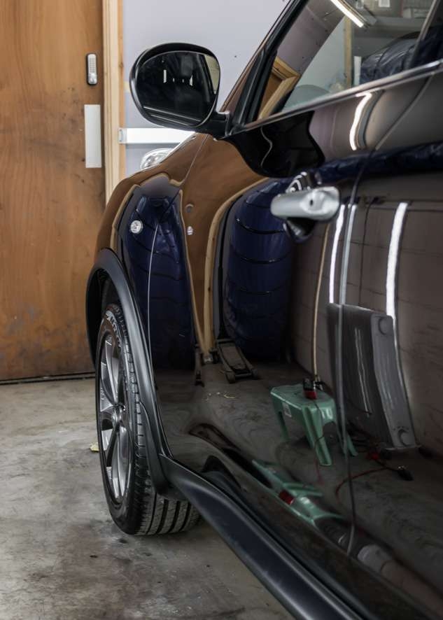 Black Nissan Juke car shiny car door after polishing, paint correction, Paintwork Enhancement and ceramic coating