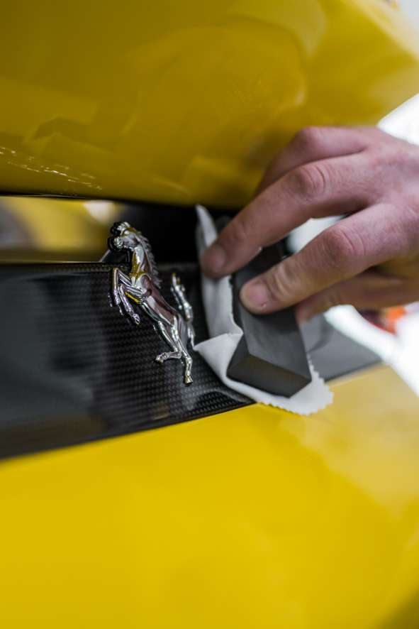 Close up shot of Kubebond ceramic coating being applied onto car yellow Ferrari 488 Pista