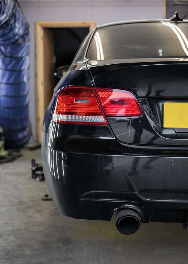 Rear side shot of BMW 3 series car with poor/bad/dull paint job before polishing