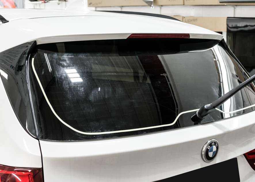 Tinted rear window on White BMW X5 using LLumar window tinting film