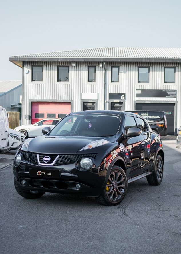 Front shot of polished and ceramic coated black Nissan Juke car