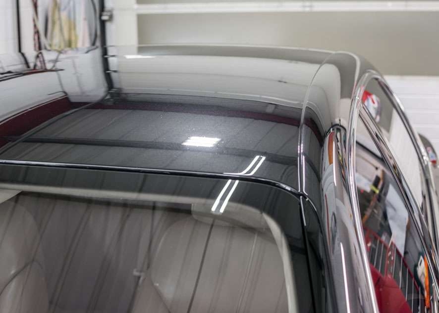 Close up shot of Bentley Flying Spur car after polishing, paint correction and Paintwork Enhancement with no scratches