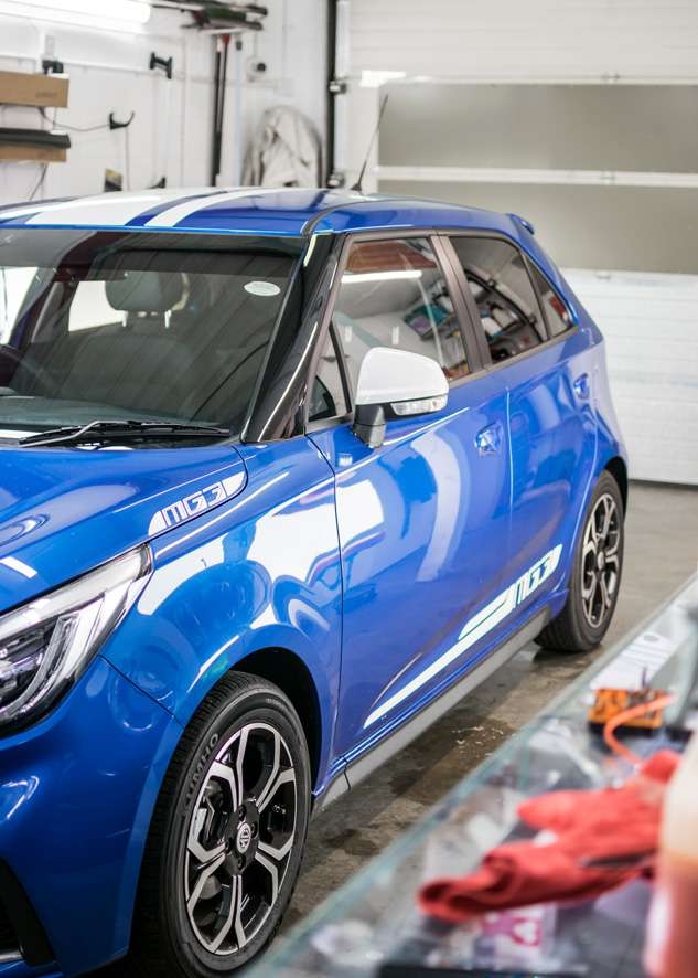 Blue MG3 car with tinted windows from front