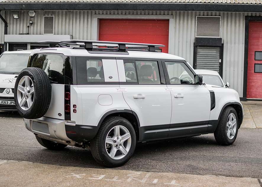 White Land Rover Defender with untinted windows before window tinting
